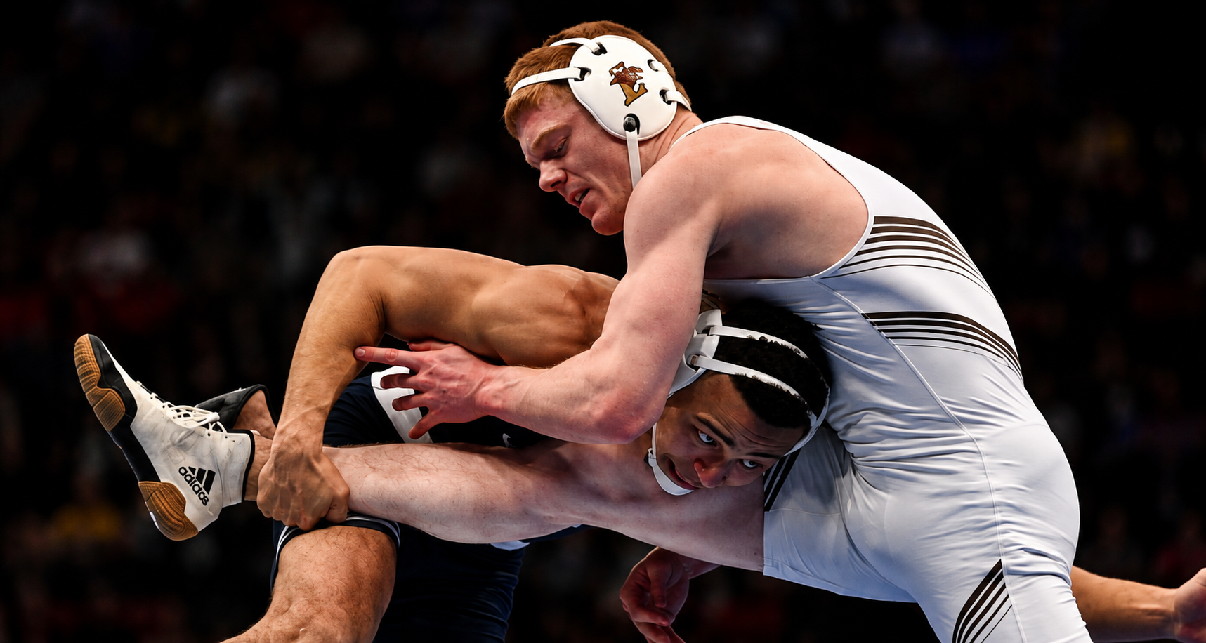 AJ Burkhart competing in collegiate wrestling